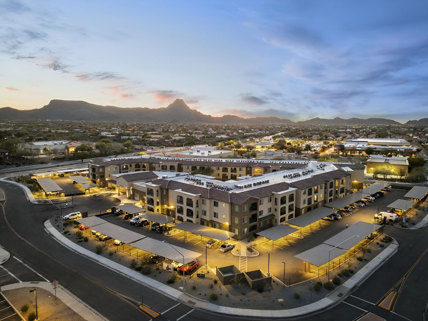 Aerial view of a senior living facility at dusk