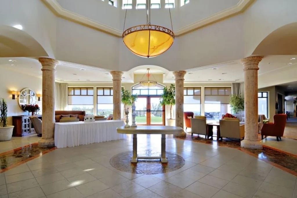 Spacious lobby area with elegant decor and seating