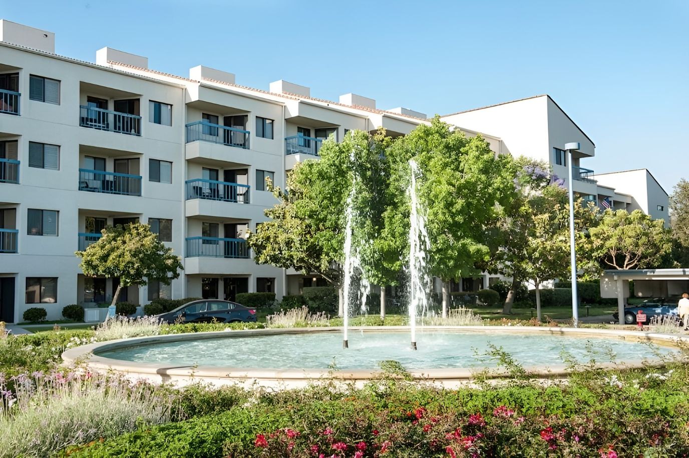 Exterior view of Regents Point with fountain and landscaping