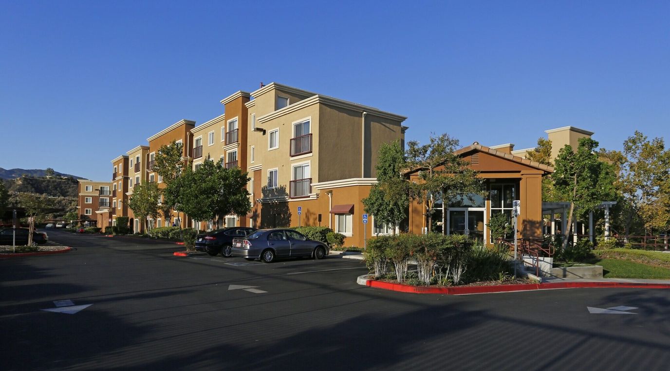 Exterior view of Canyon Country Senior facility with parking lot