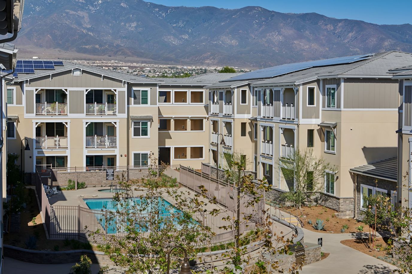 View of the senior living facility courtyard with a pool
