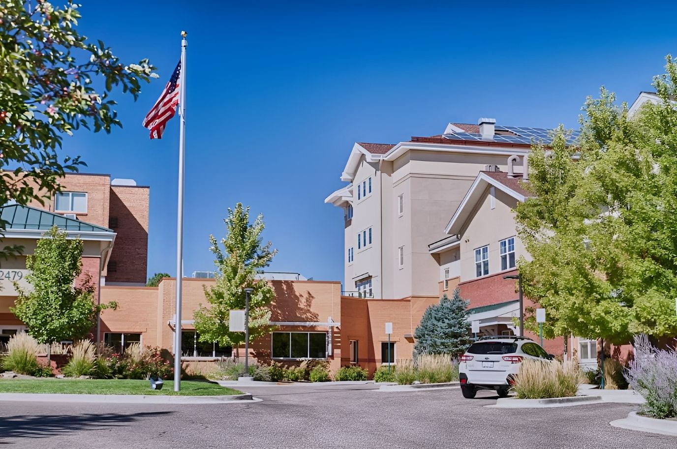 Exterior view of Clermont Park with trees and flag