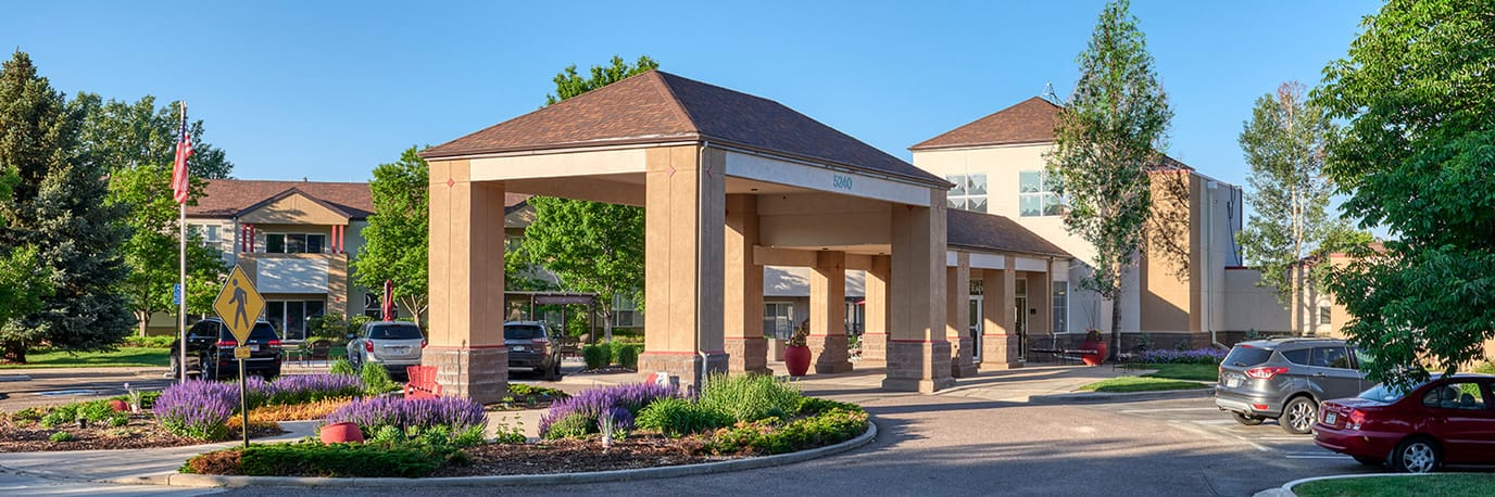 Exterior view of the nursing home entrance with landscaping