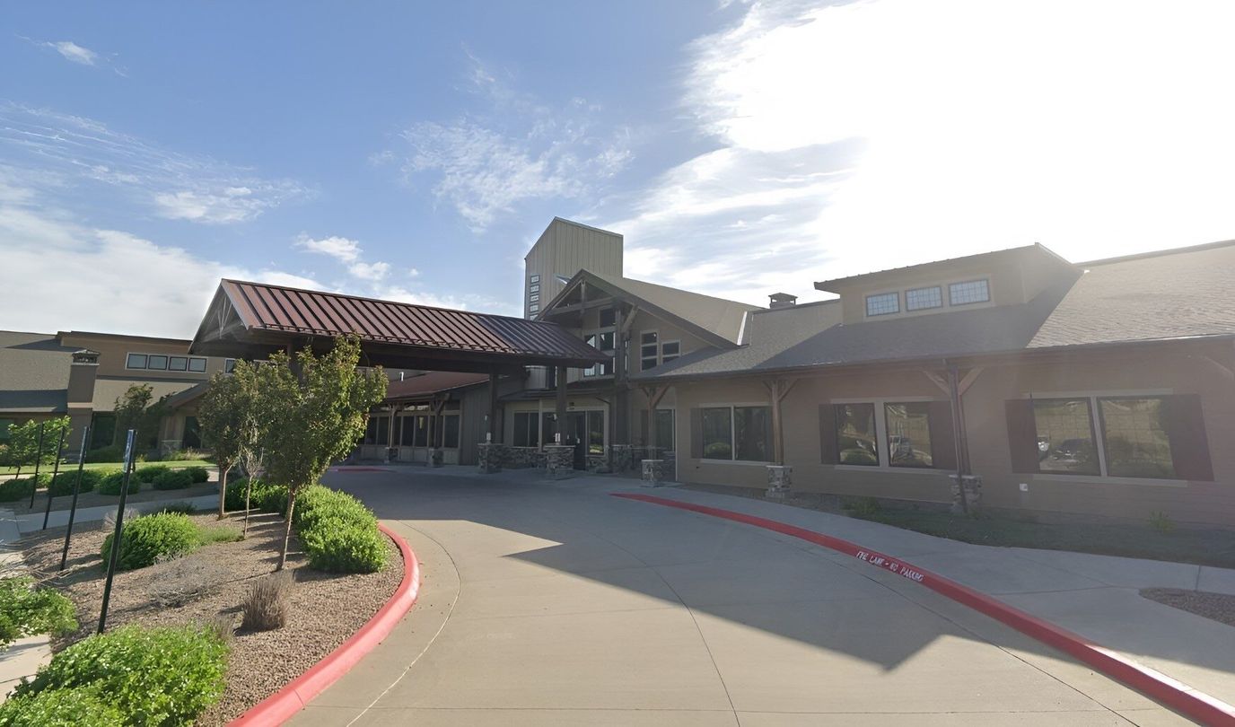 Exterior view of The Cottages Senior Care Living facility
