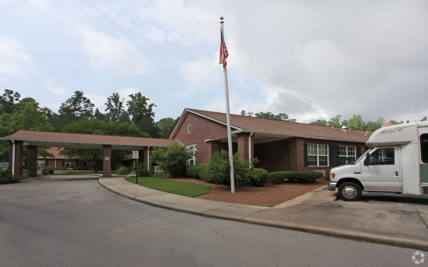 Exterior view of the facility with an accessible vehicle