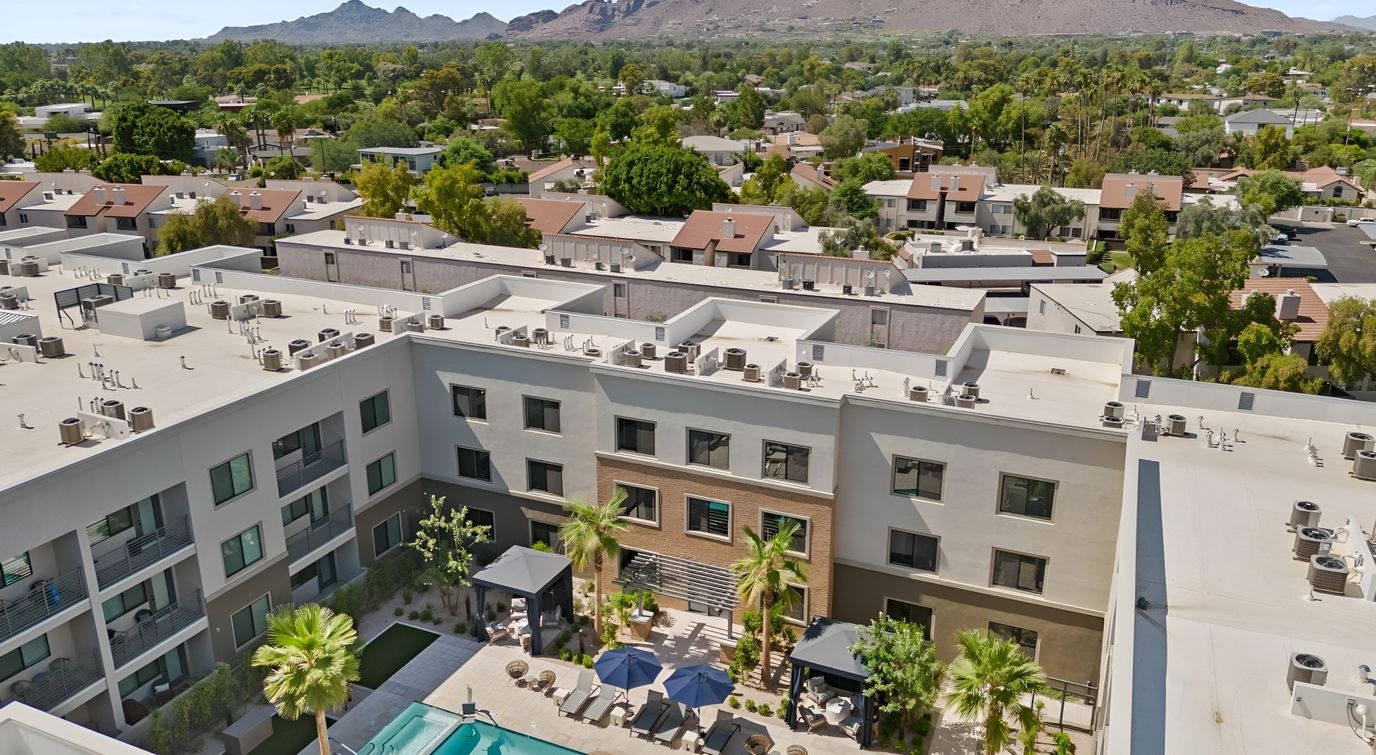 Aerial view of a senior living facility with outdoor space