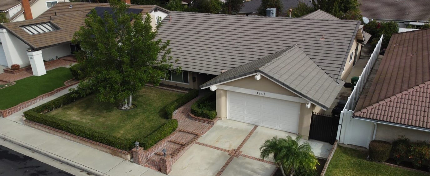 Aerial view of a residential building with landscaping
