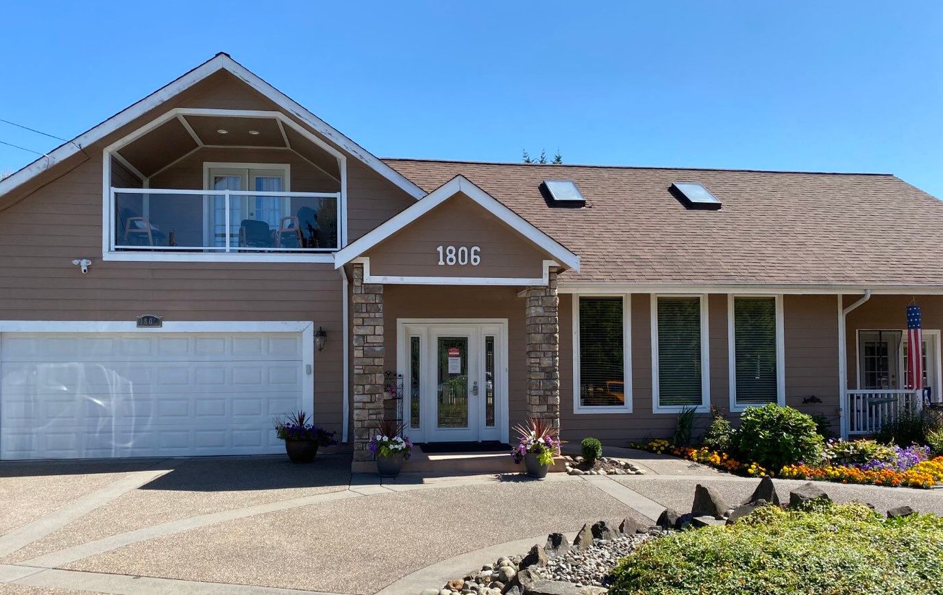 Exterior view of the facility with front entrance and landscaping
