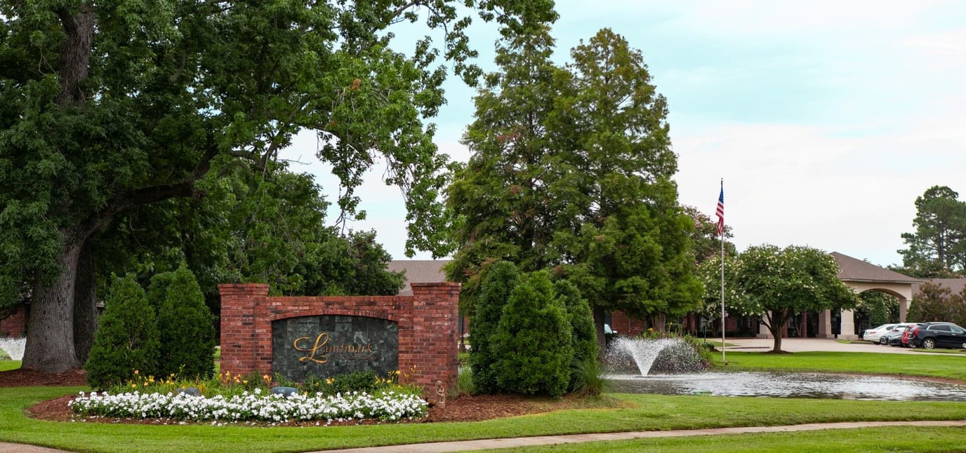 Exterior view of the Landmark of Baton Rouge entrance with landscaping