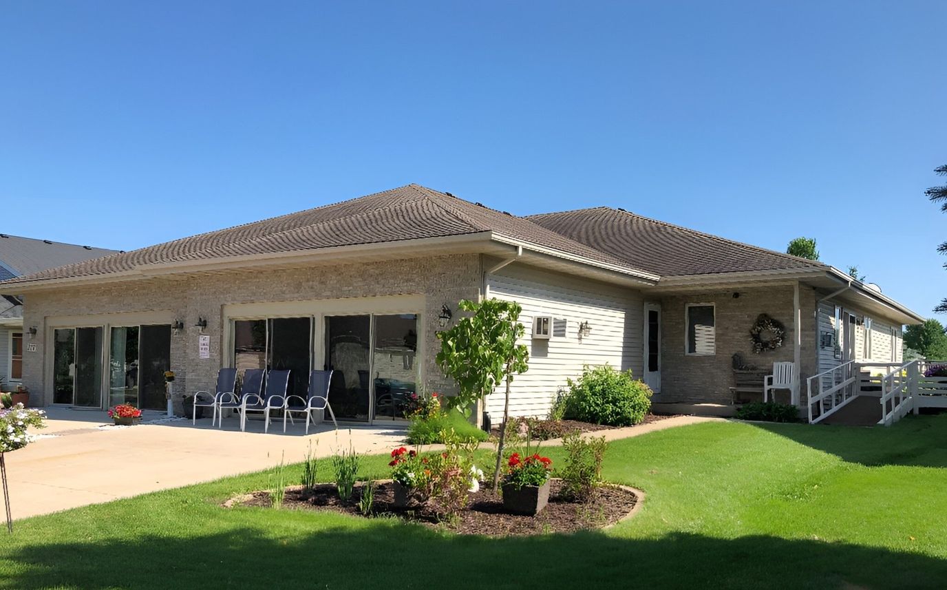 Exterior view of the assisted living facility with greenery