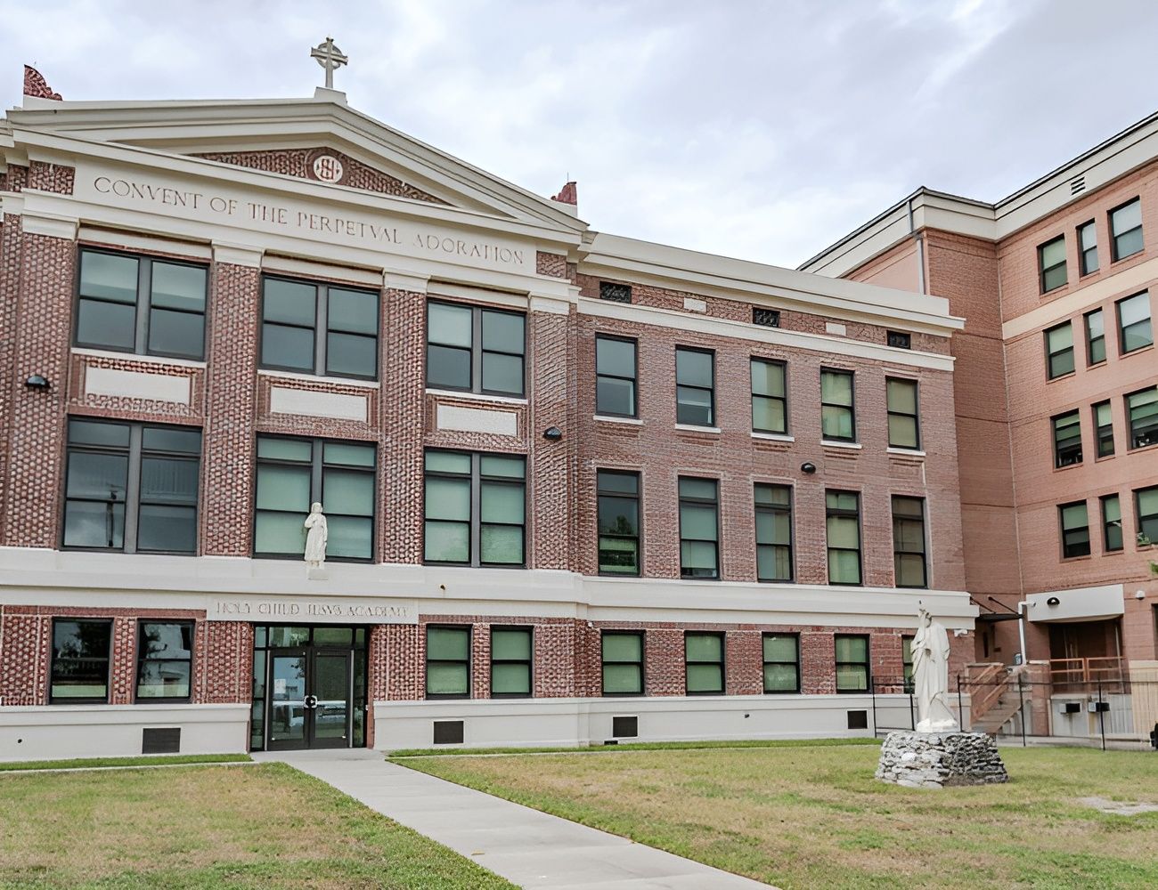 Exterior view of a building with landscaped entrance