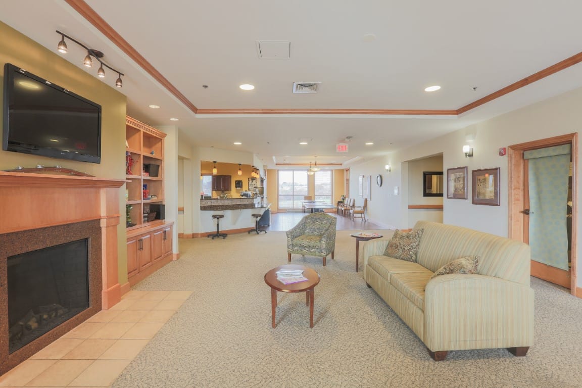 Interior common area with comfortable seating and a fireplace