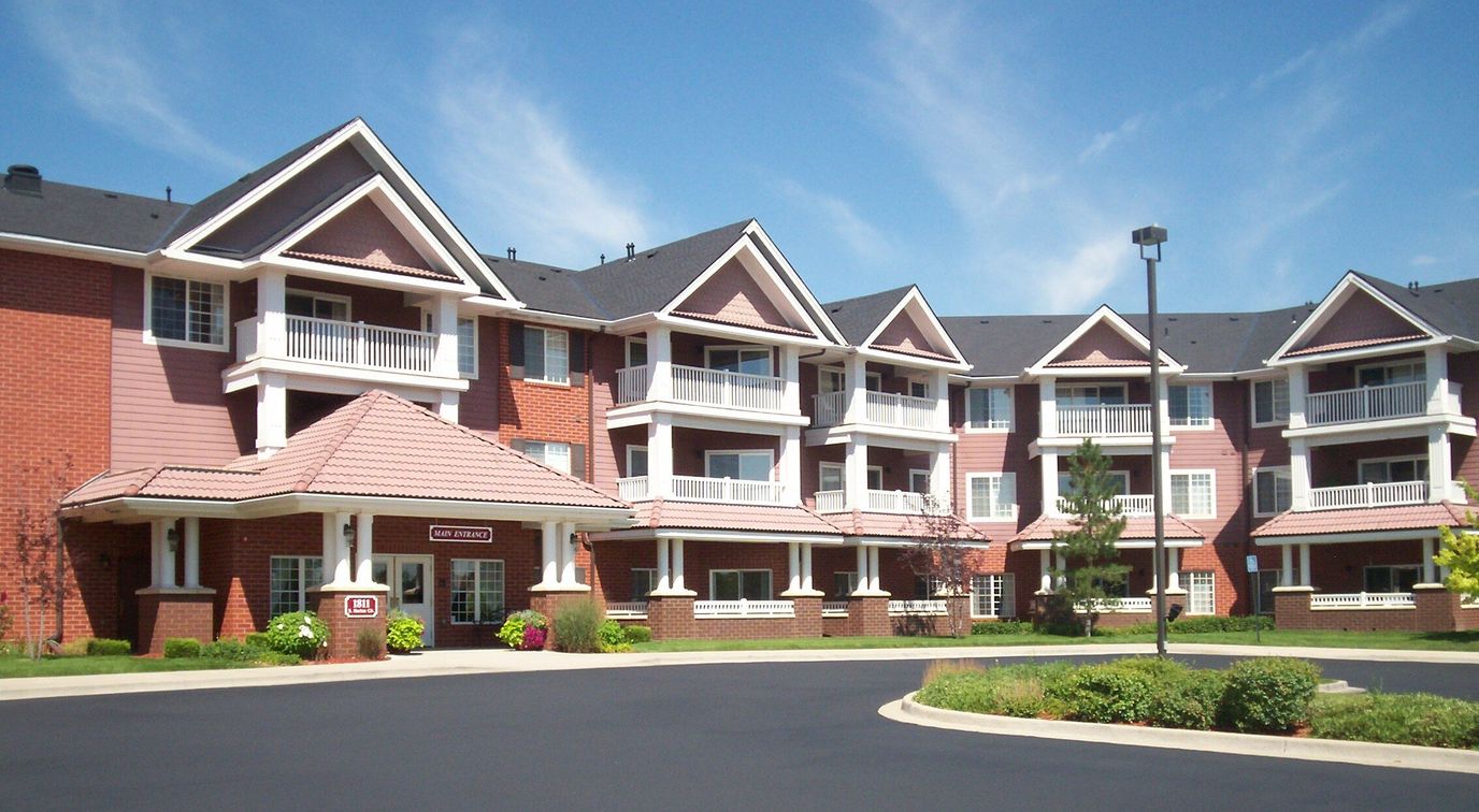 Exterior view of a senior living facility with a welcoming entrance