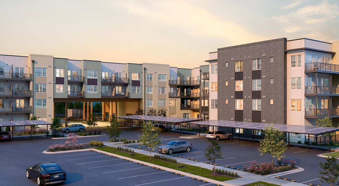 Exterior view of a senior living facility with parking area