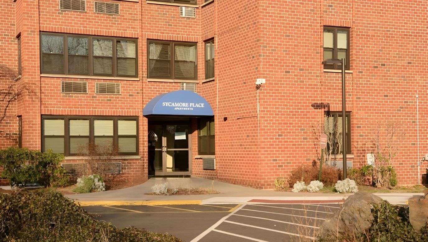 Exterior of Sycamore Place Apartments building entrance