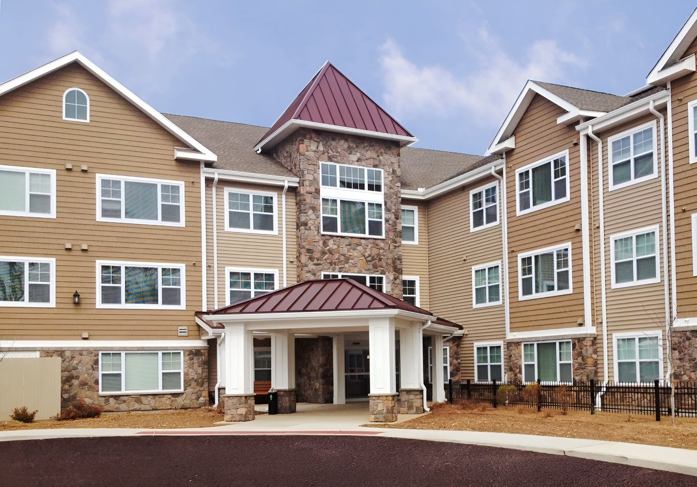 Exterior view of a senior living facility with a welcoming entrance