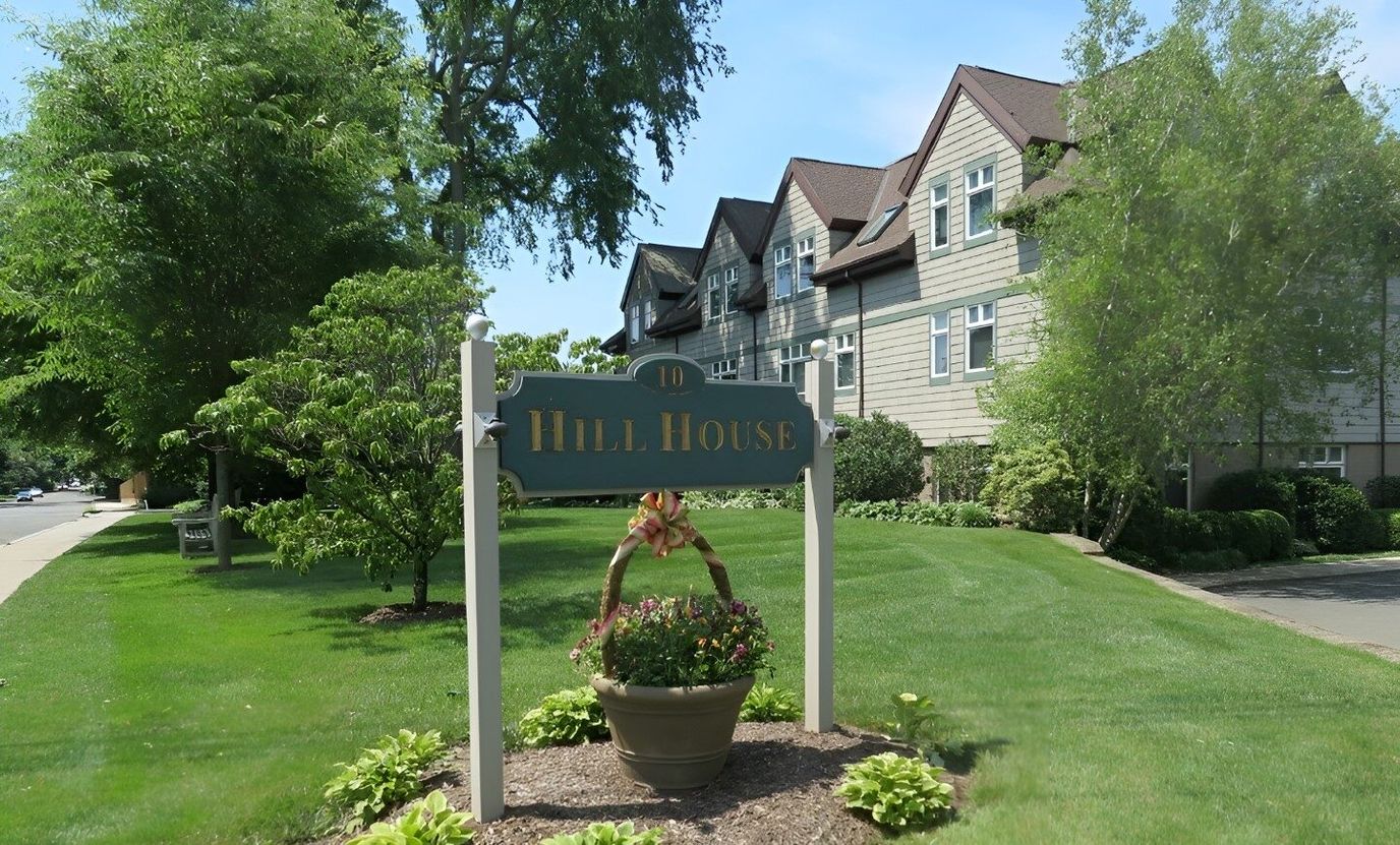 Signpost for Hill House with landscaped surroundings