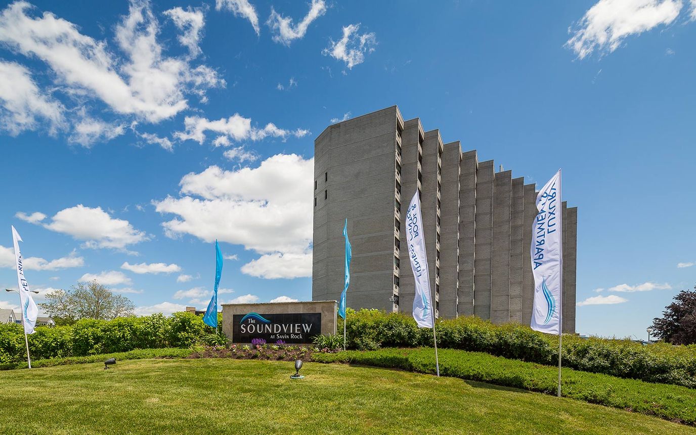 Exterior view of The Soundview nursing home with flags