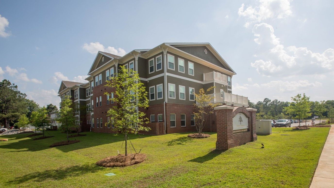 Exterior view of Pointe North Village with landscaping