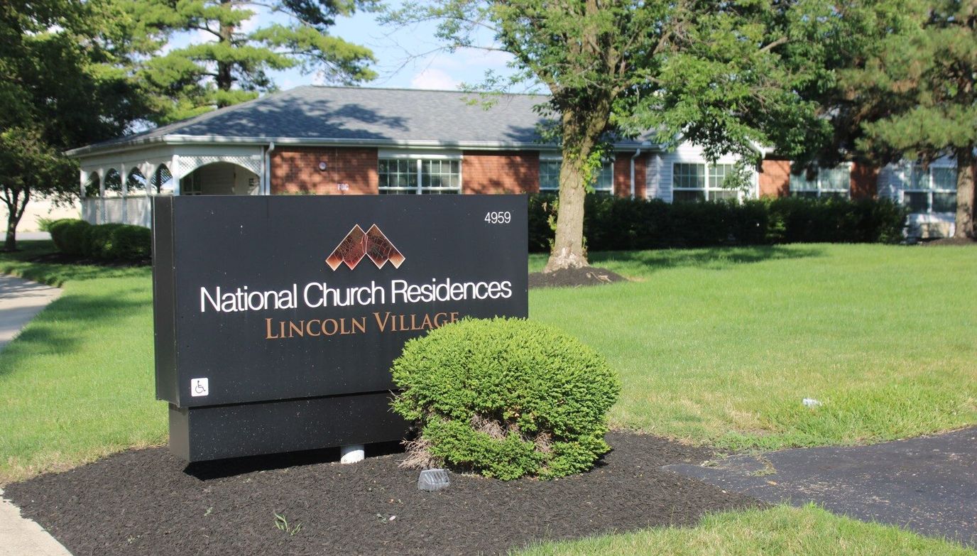 Exterior view of Lincoln Village with signage