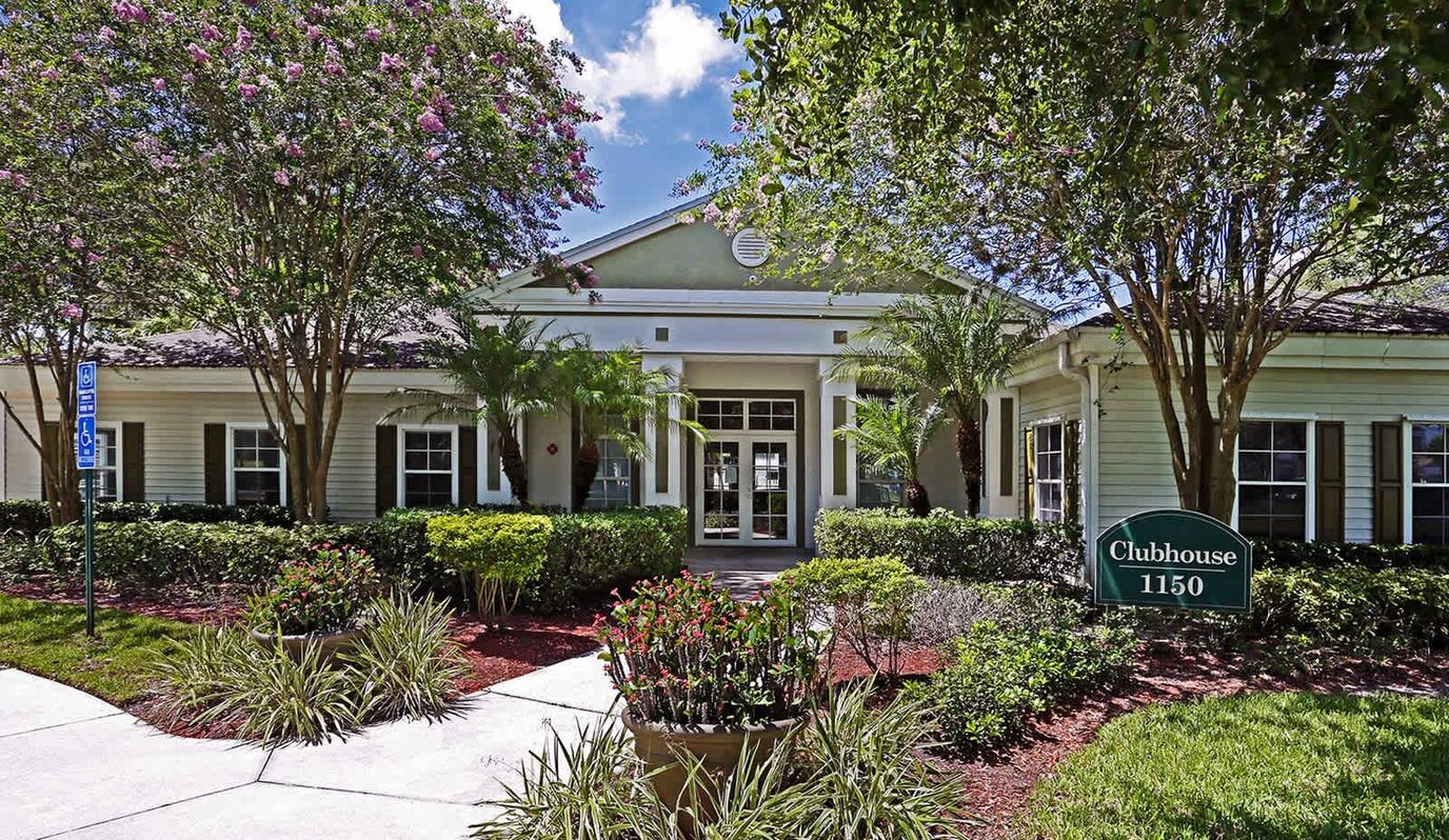 Exterior view of the clubhouse surrounded by landscaping