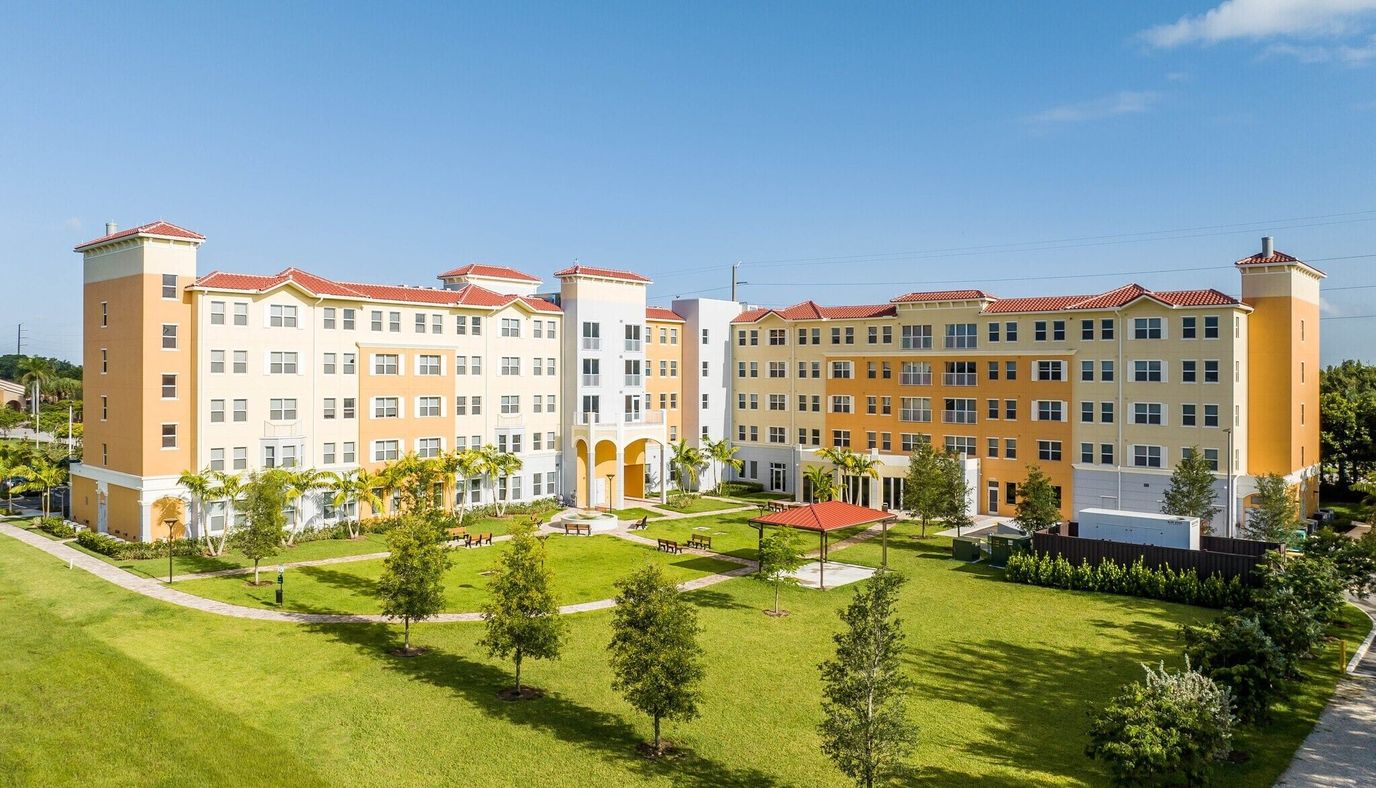 Aerial view of a senior living facility with outdoor spaces