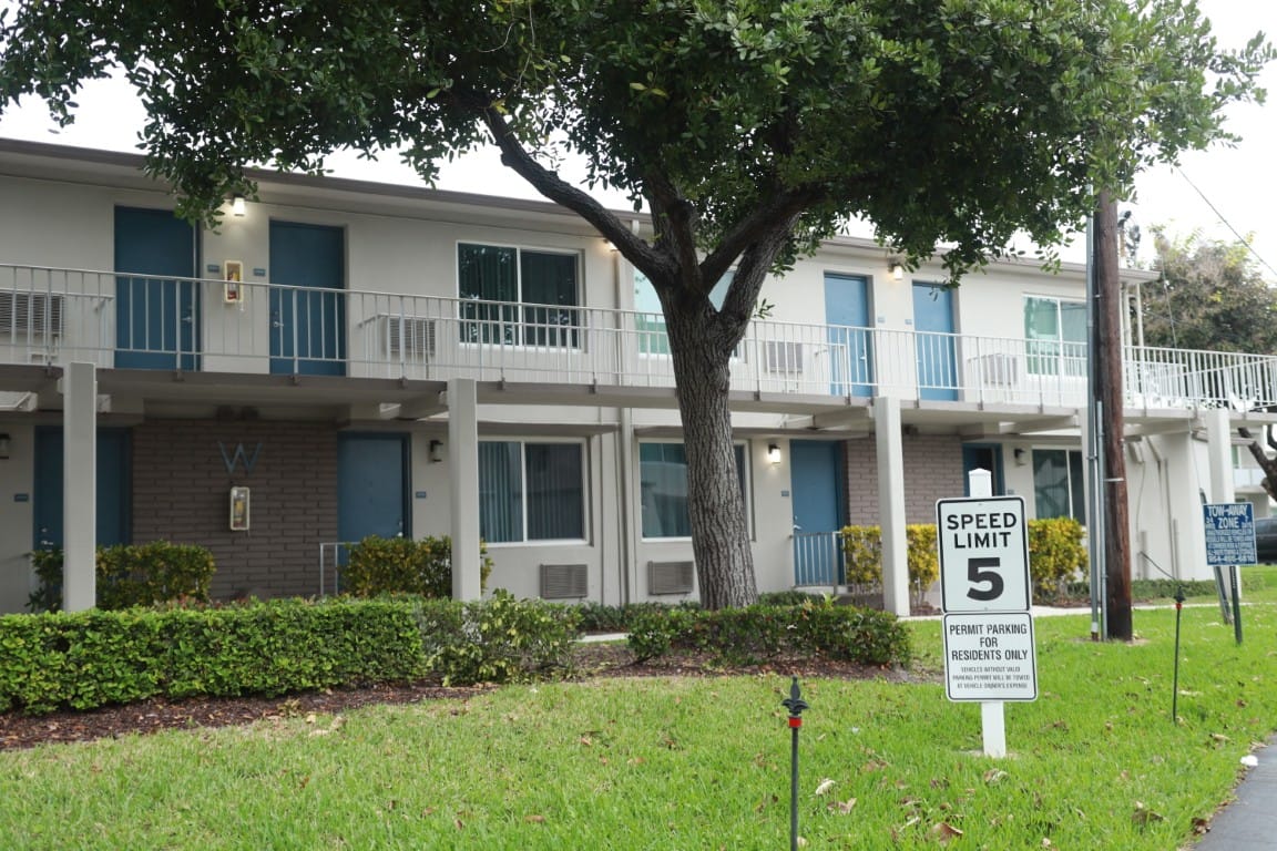 Exterior view of Gateway Terrace Senior Apartments with greenery