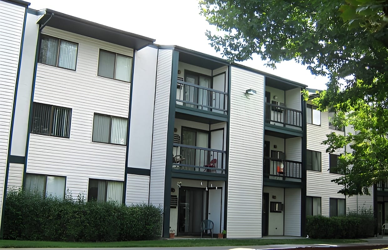 Exterior view of Franklin Grove Apartments with balconies