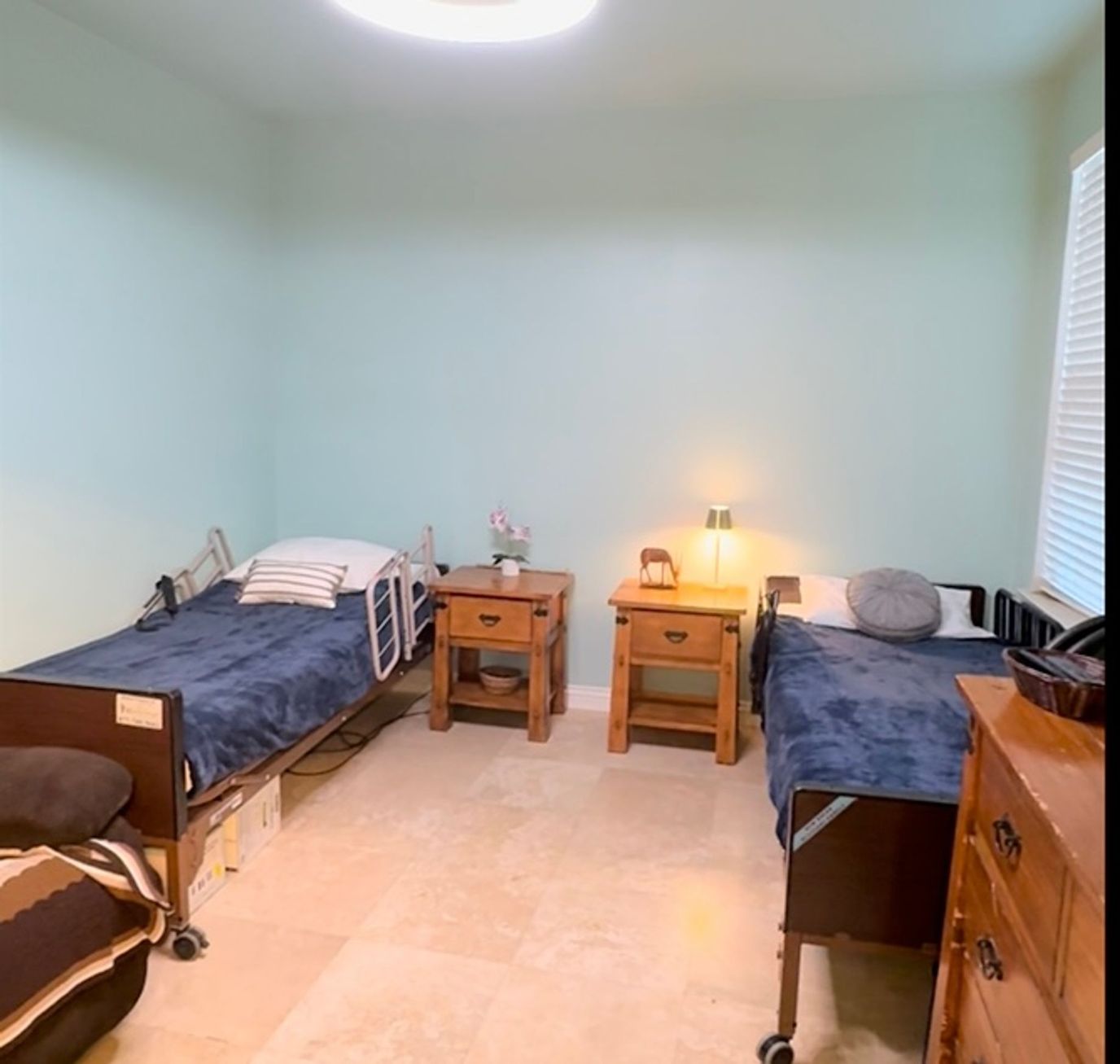 A cozy room with two beds and bedside tables