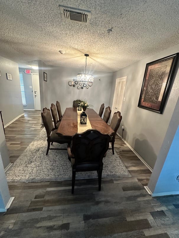 Dining room with a long wooden table and chairs