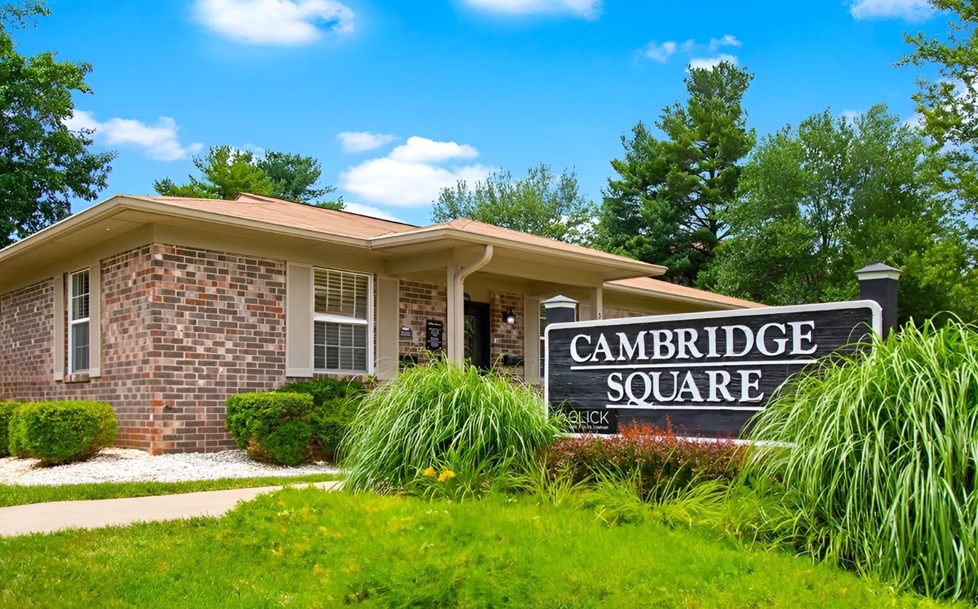 Exterior view of Cambridge Square Apartments building and signage