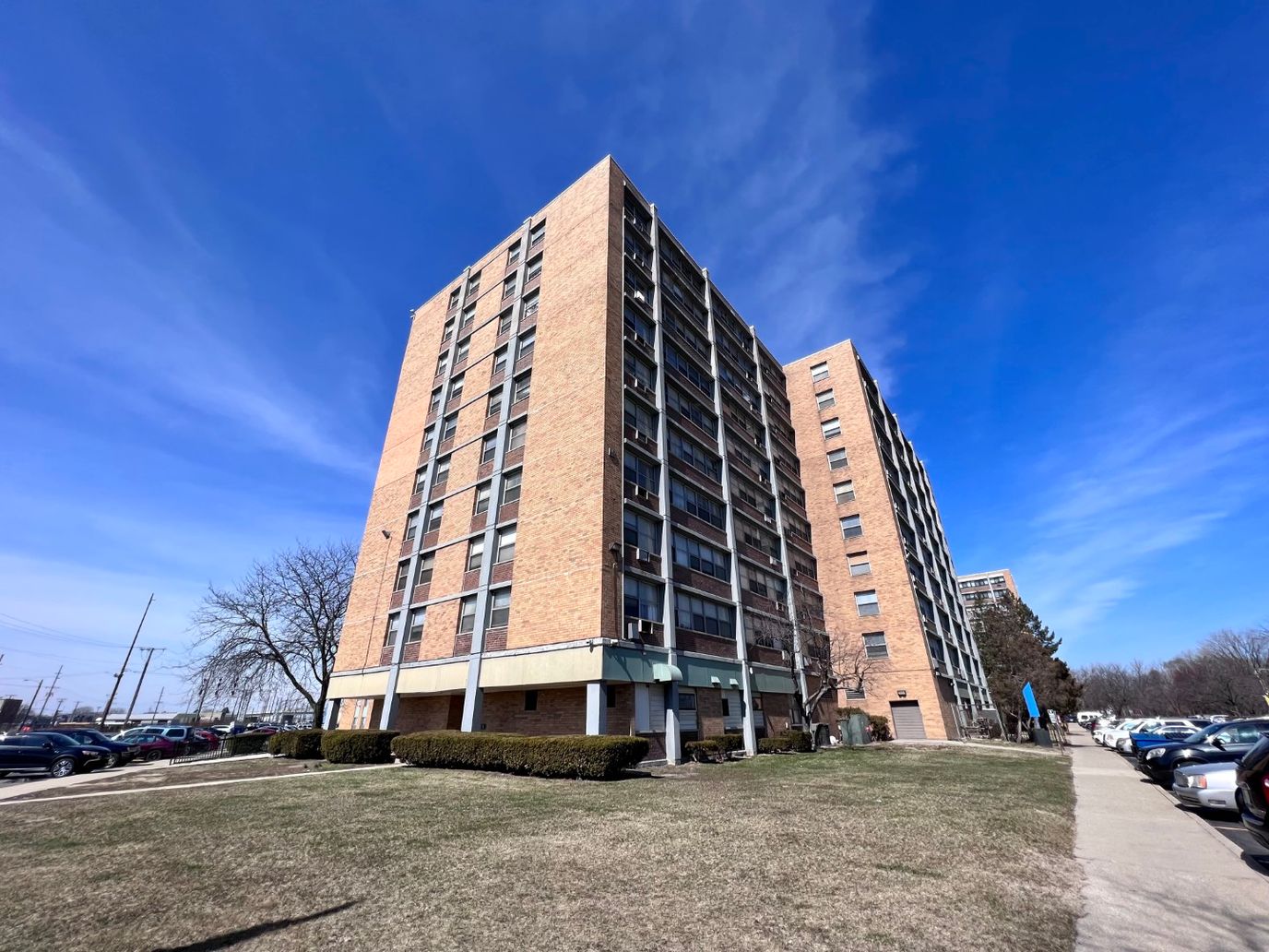 Exterior view of Renaissance Towers building under a blue sky
