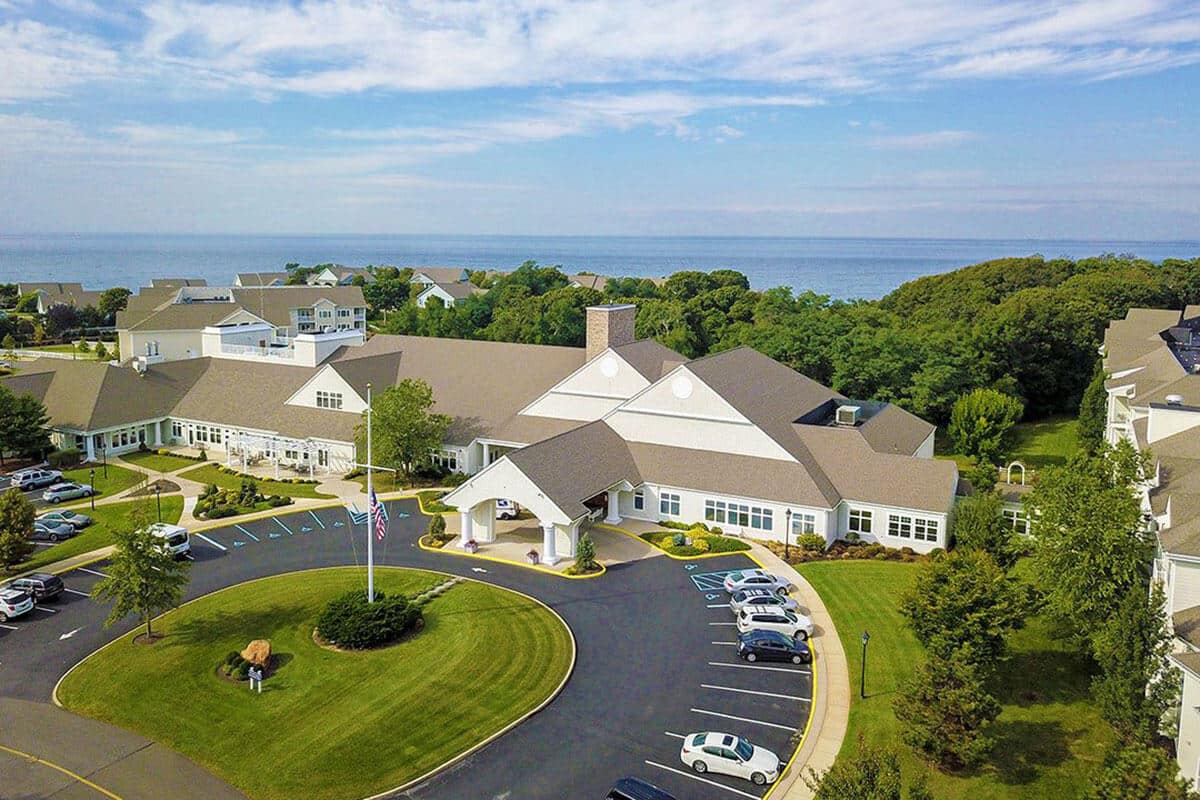 Aerial view of Peconic Landing facility with gardens and parking
