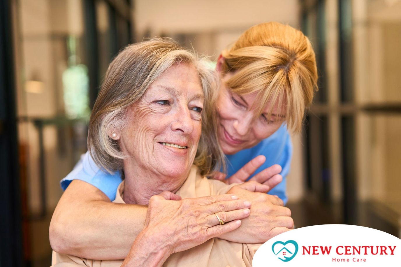 Caregiver embracing a senior resident in a warm setting