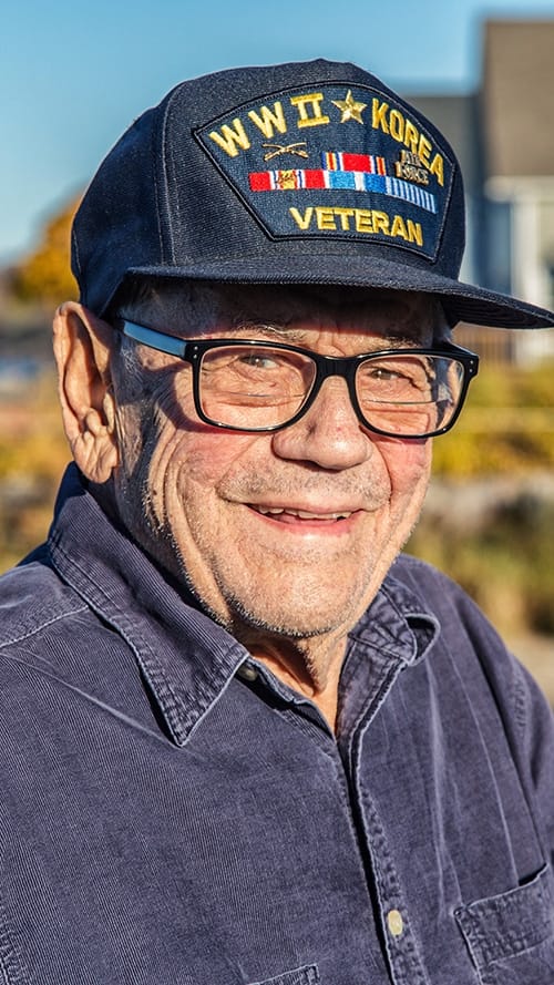 Senior veteran with a cap outdoors