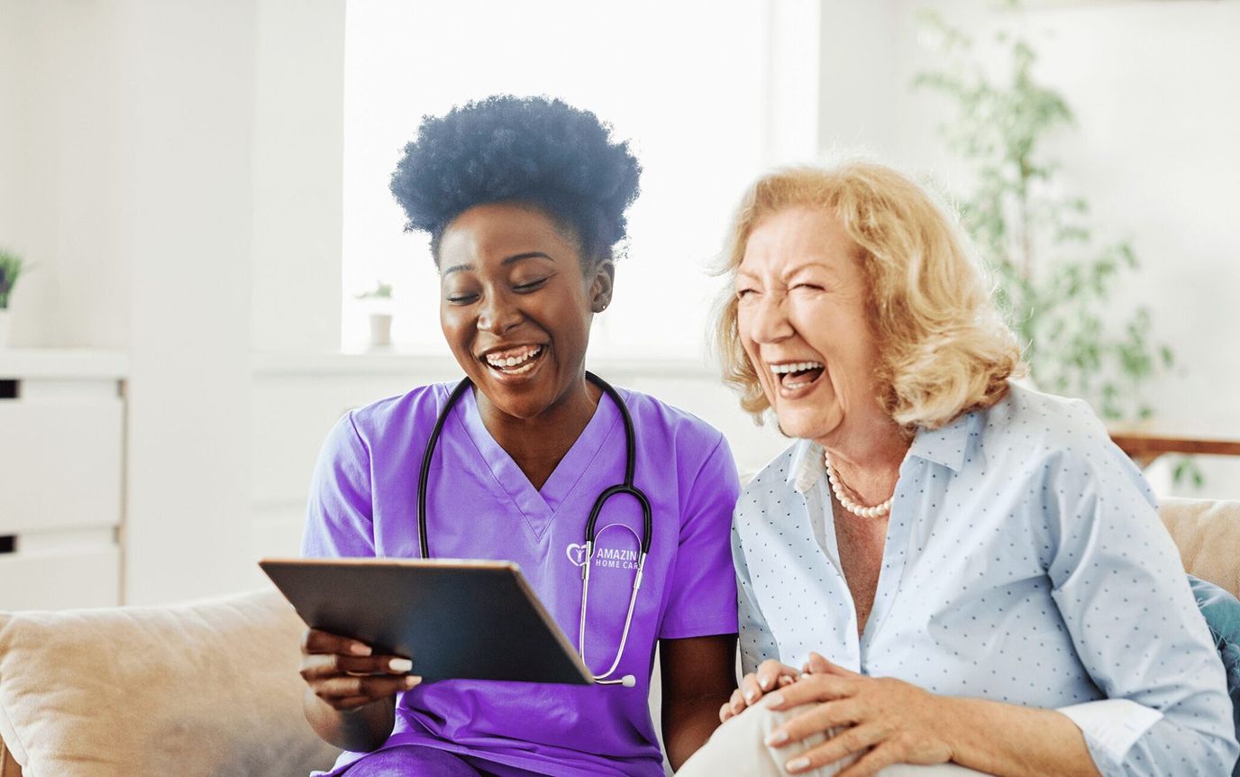 Caregiver and resident sharing a joyful moment