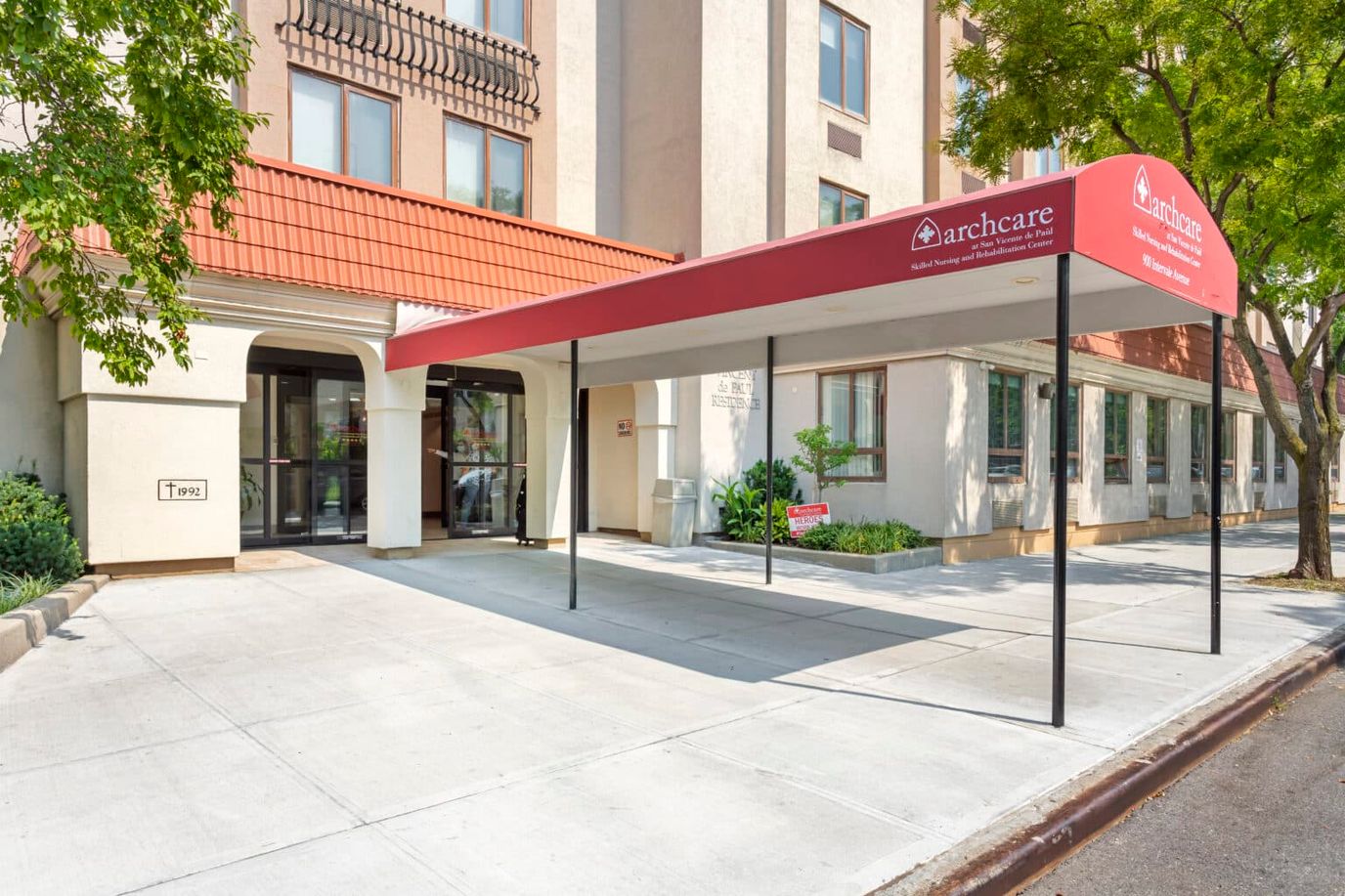 Entrance of Archcare Senior Life facility with awning