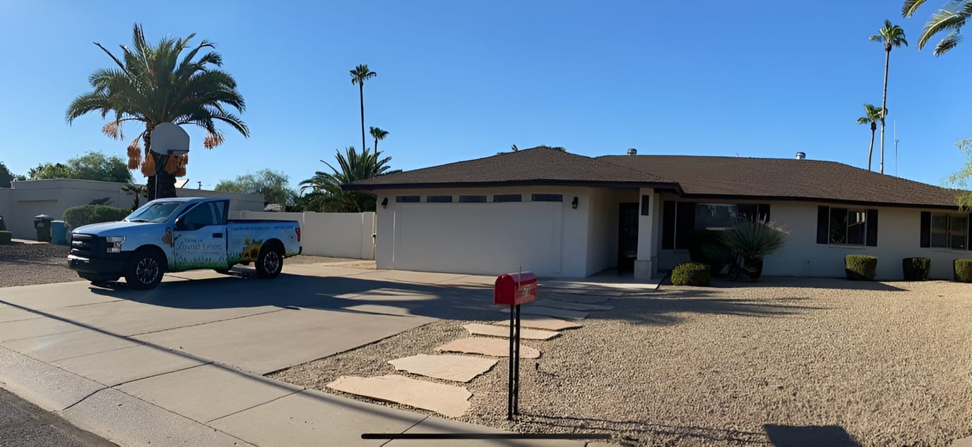 Exterior view of a residential care facility with a truck