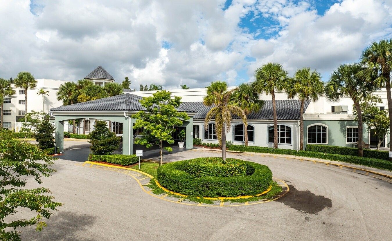 Exterior view of the facility entrance with landscaping