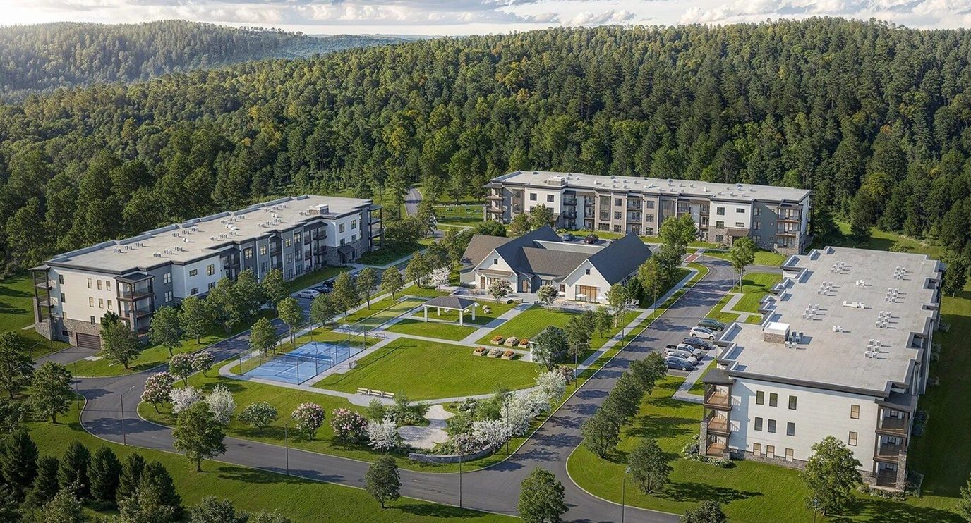 Aerial view of a senior living campus with green spaces