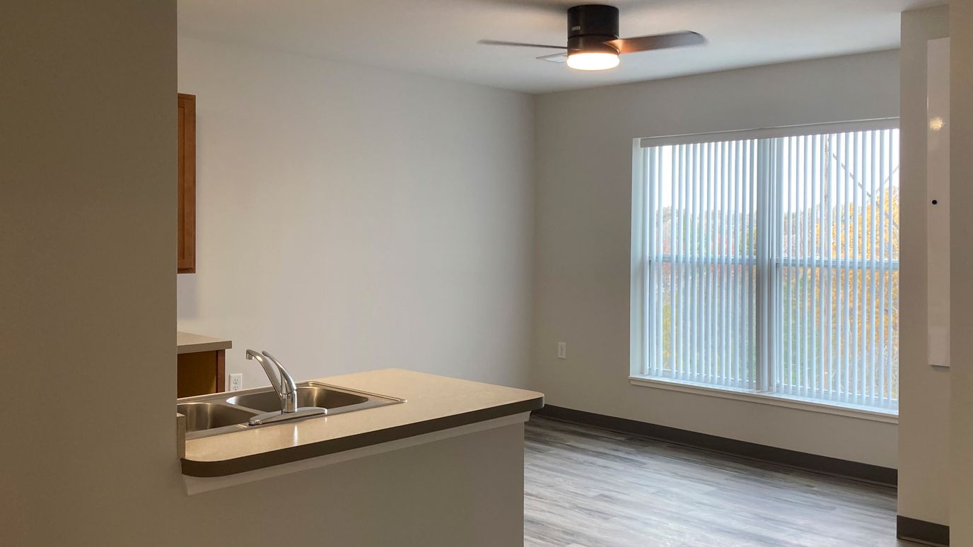 Bright interior view of a resident room with kitchen