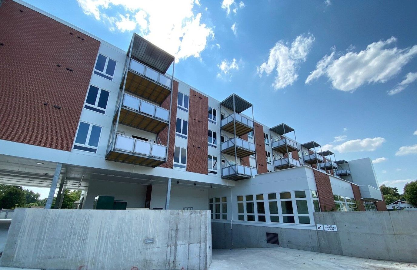 Exterior view of a senior living facility with balconies