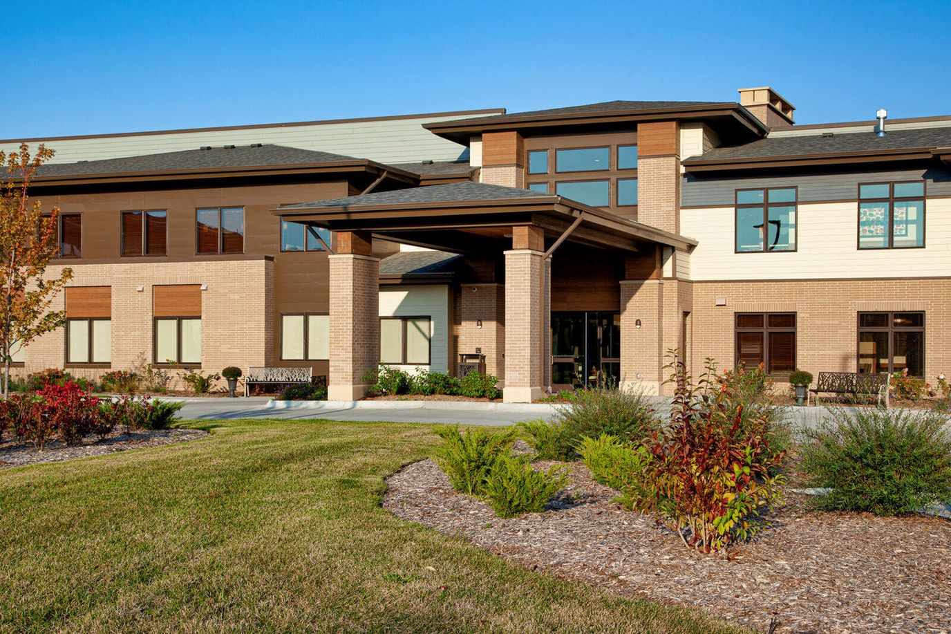 The exterior of Prairie Gate facility with landscaped gardens