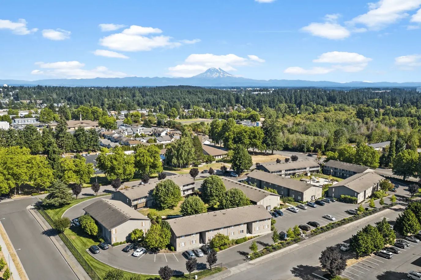 Aerial view of Wickshire West Senior Apartments with surrounding greenery