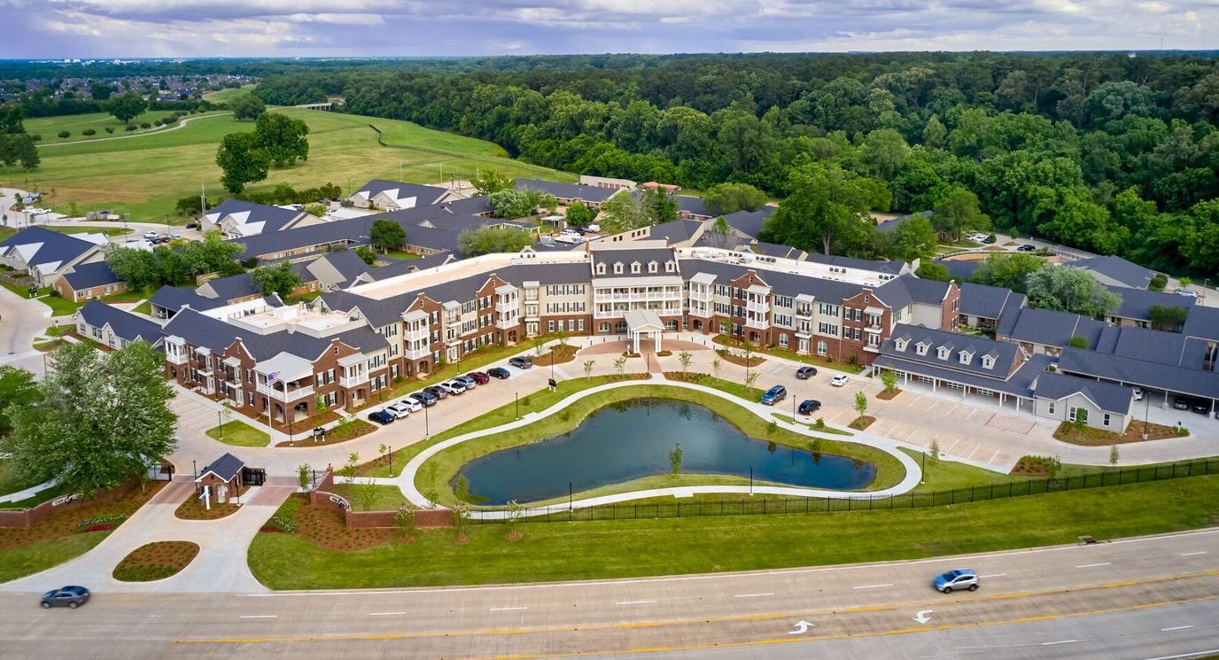 Aerial view of the retirement community with landscaped areas