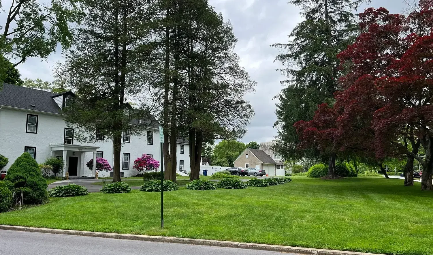 Exterior view of a senior living facility with landscaped gardens