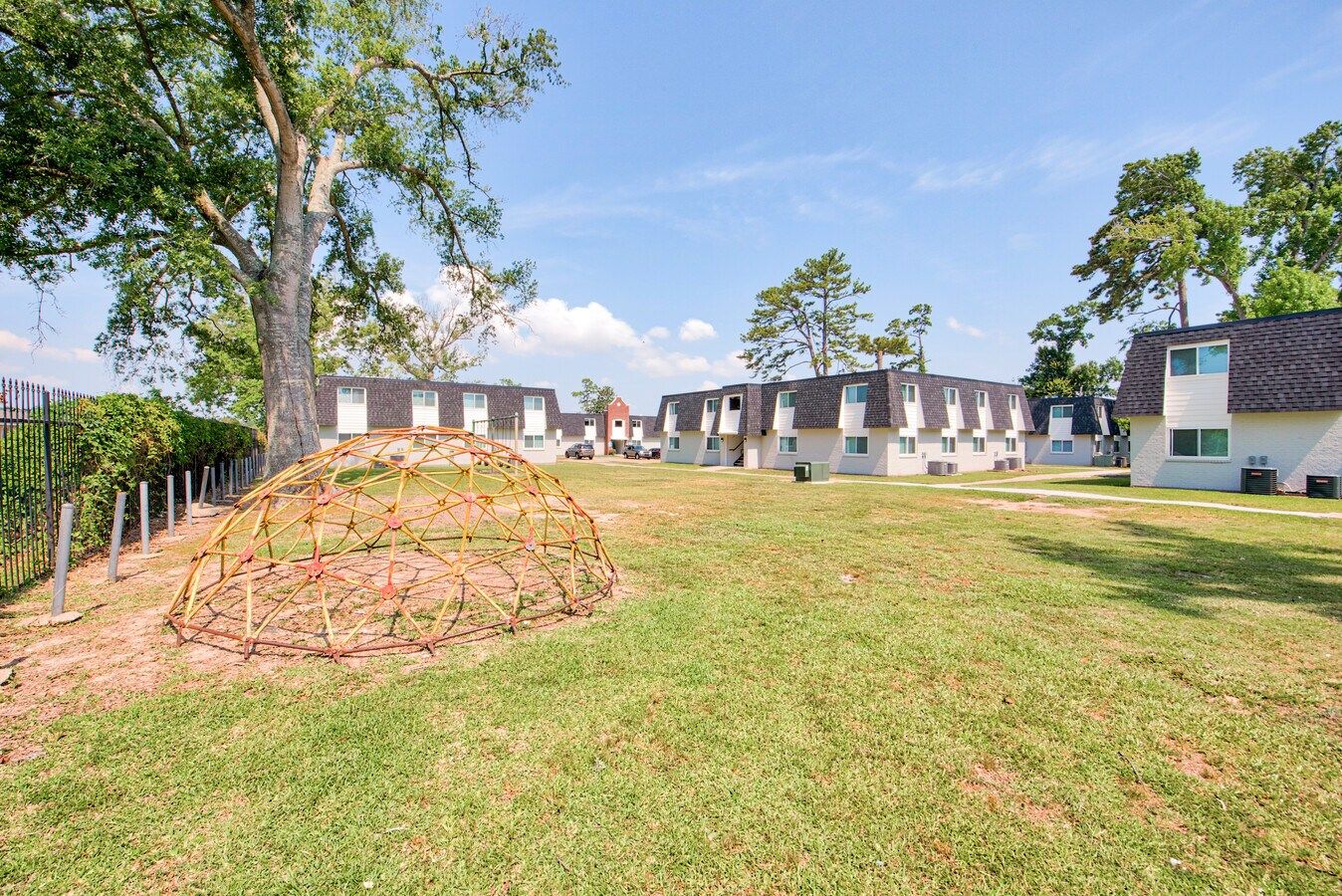 Outdoor view of St. Charles Place Apartments with playground