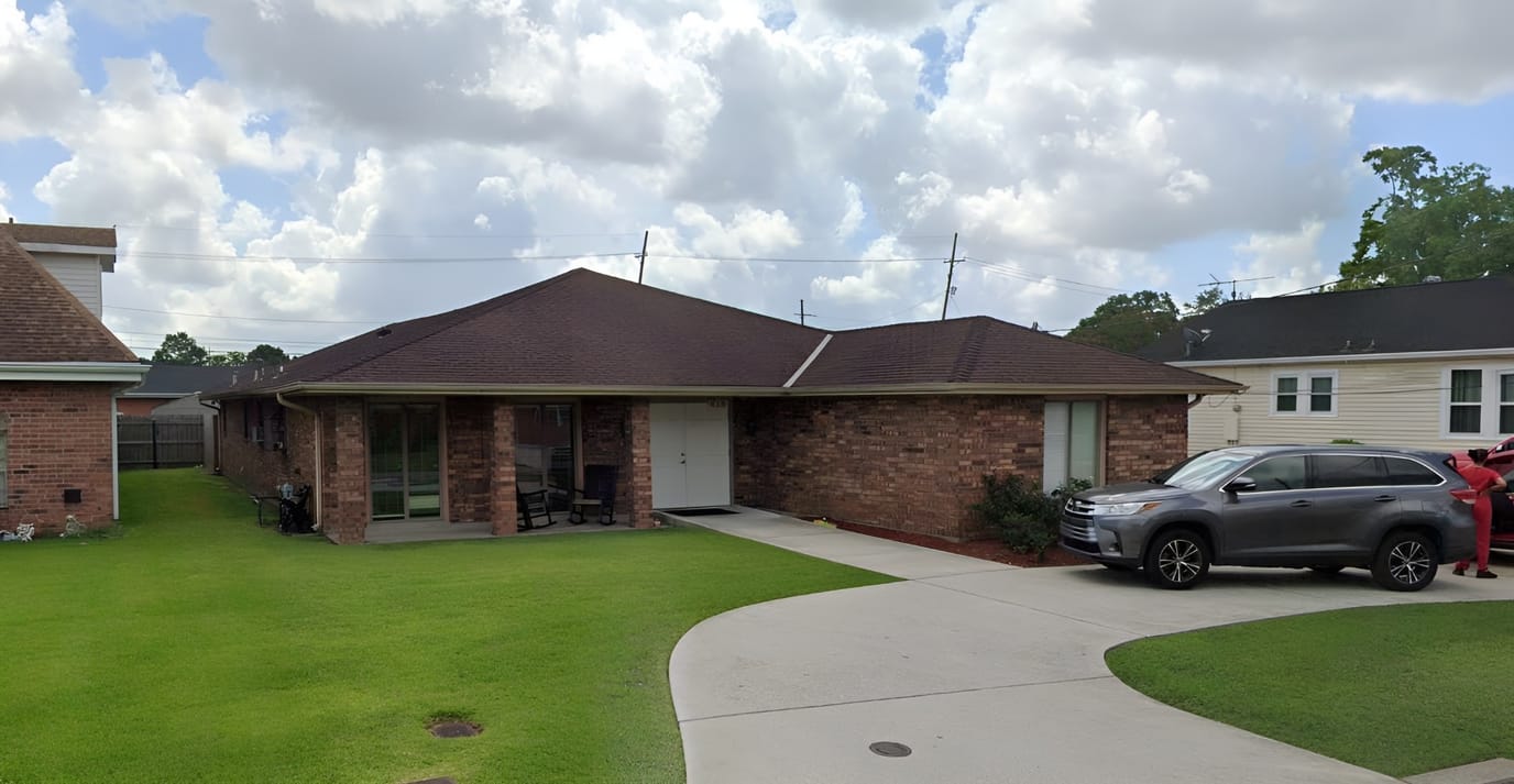 Exterior view of Tranquil Living II facility with outdoor space