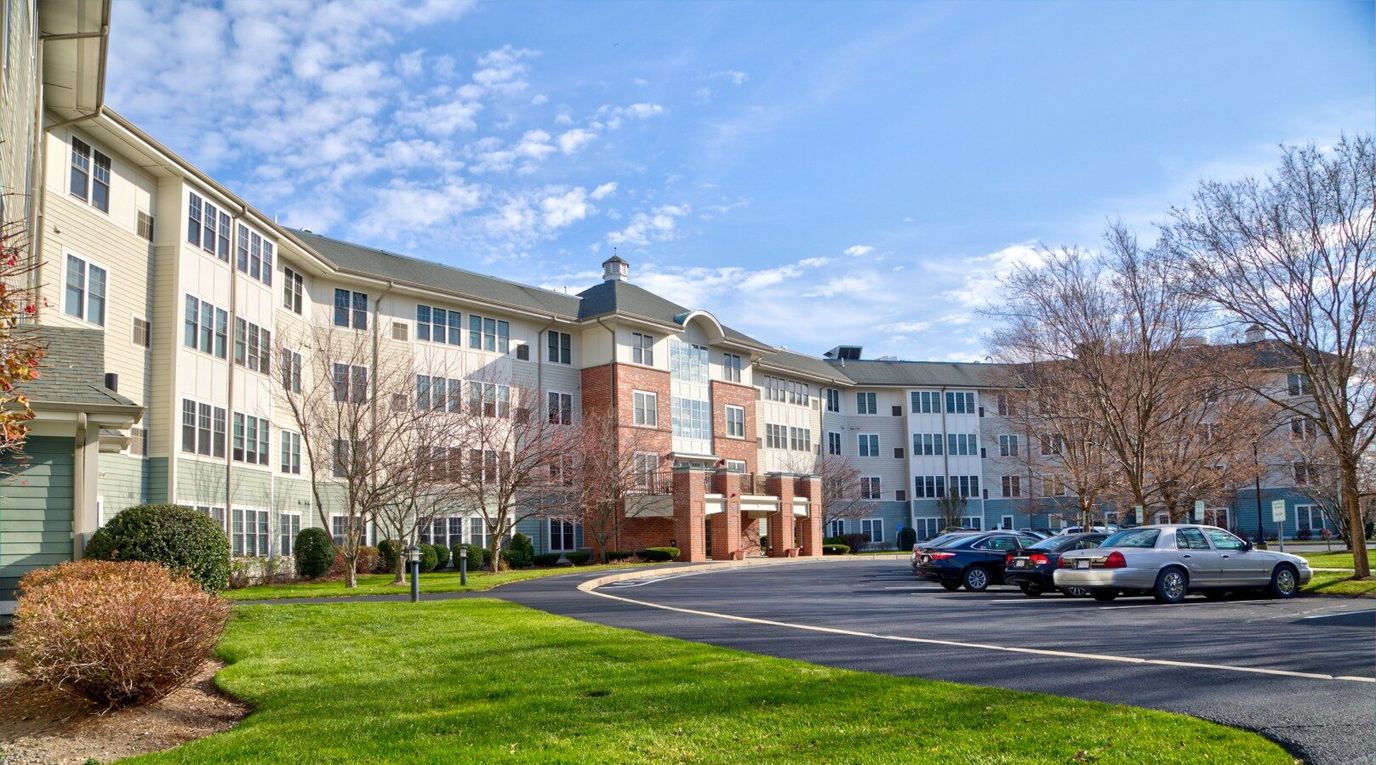 Exterior view of the facility with parking and landscaping.