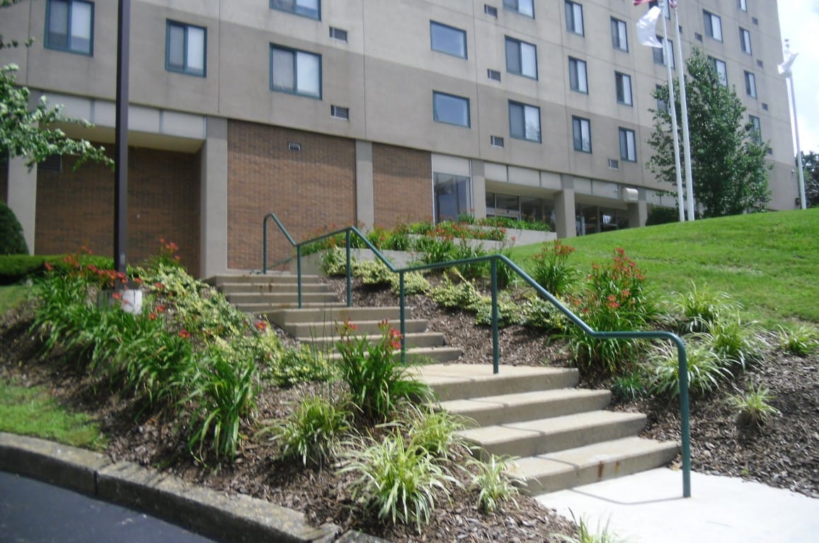 Entrance with landscaped stairs leading to the facility